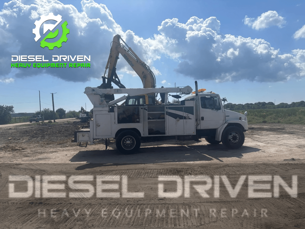 A white heavy-duty truck with a mounted crane is parked on a dirt surface under a cloudy sky, featuring the logo of Diesel Driven Heavy Equipment Repair.